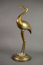 BENARES BRASS MODEL OF A STORK, on a circular base, 18” (45.7cm) high