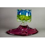 TWO MODERN CZECHOSLAVAKIAN HOT WORKED COLOURED GLASS BOWLS, one of footed form in fading blue and