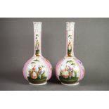 PAIR OF DRESDEN CHINA GLOBE AND SHAFT SHAPED VASES, painted in alternate reserves with courtiers