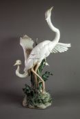 LARGE LLADRO-SPAIN PORCELAIN GROUP DEPICTING TWO CRANES possibly in a courtship dance, one with