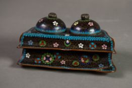 JAPANESE MEIJI PERIOD CLOISONNE DOUBLE INKWELL, of shaped oblong form with white ceramic holders,