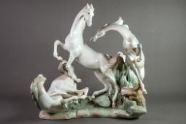 LARGE LLADRO-SPAIN PORCELAIN GROUP DEPICTING THREE HORSES FIGHTING sculpted by Fulgencio Garcia