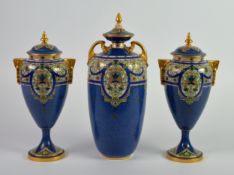 THREE EARLY TWENTIETH CENTURY ROYAL WORCESTER POWDER BLUE PORCELAIN VASES AND COVERS, comprising: