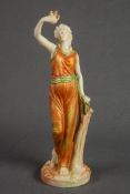 LATE VICTORIAN ROYAL WORCESTER PORCELAIN JAMES HADLEY STYLE FEMALE FIGURE holding aloft a BIRD in