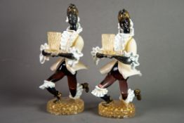 PAIR OF MURANO COLOURED AND AVENTURINE GLASS FIGURAL CANDLE HOLDERS, each modelled in kneeling