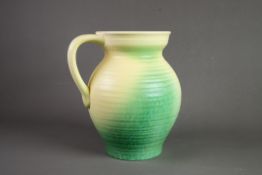 ROYAL CAULDON POTTERY LARGE JUG, of ribbed form with loop handle, glazed in fading tones of yellow