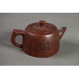 CHINESE YIXING RED POTTERY MINIATURE TEAPOT, incised with character marks, 2 ½” (6.3cm) high,