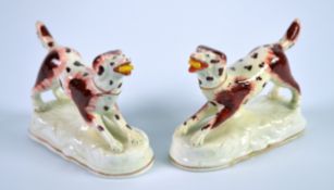 PAIR OF NINETEENTH CENTURY ENGLISH PORCELAIN MODELS OF SPANIELS, each modelled standing with a