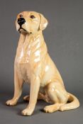 PROBABLY BESWICK, POTTERY MODEL OF A SEATED LABRADOR, 13” (33cm) high, green baize stuck to the base