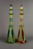 PAIR OF URANIUM FLASH CUT GLASS DECANTERS AND STOPPERS, each of conical form with pointed stopper,