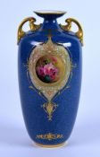 EARLY TWENTIETH CENTURY FLORAL PAINTED ROYAL WORCESTER TWO HANDLED POWDER BLUE PORCELAIN VASE BY