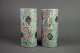 PAIR OF MID TO LATE TWENTIETH CENTURY CHINESE PORCELAIN SLEEVE VASES, each pierced with shaped ovals