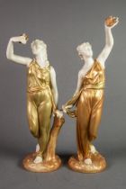 PAIR OF EDWARDIAN ROYAL WORCESTER IVORY GROUND CLASSICAL FEMALE FIGURES with gilt robes, each with
