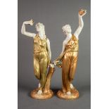 PAIR OF EDWARDIAN ROYAL WORCESTER IVORY GROUND CLASSICAL FEMALE FIGURES with gilt robes, each with