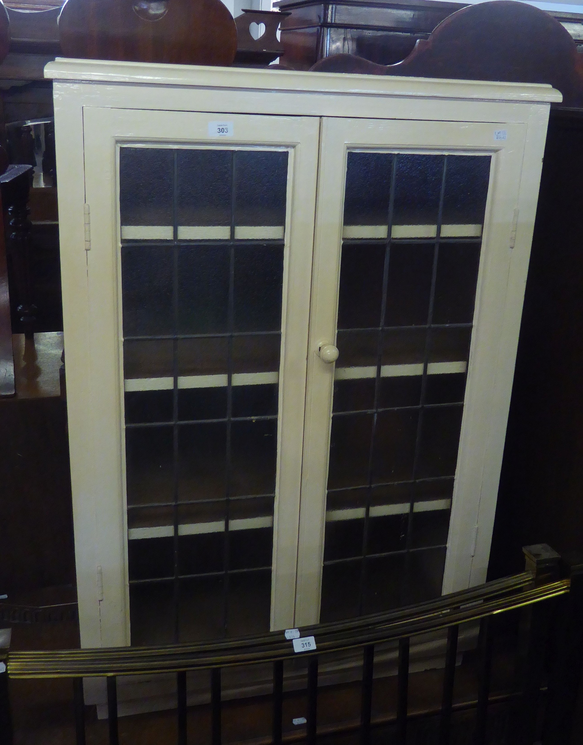 WHITE PAINTED CUPBOARD ENCLOSED BY TWO LEAD-LIGHT DOORS