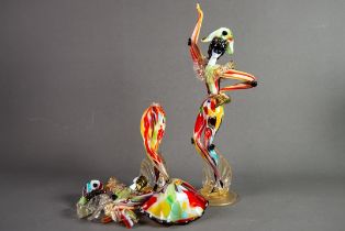 PAIR OF MURANO COLOURED GLASS FIGURES OF HARLEQUINS, each modelled in stylised pose, on a circular