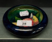 A WALTER MOORCROFT 'ORCHID' POTTERY CIRCULAR PIN DISH, 12cm diameter