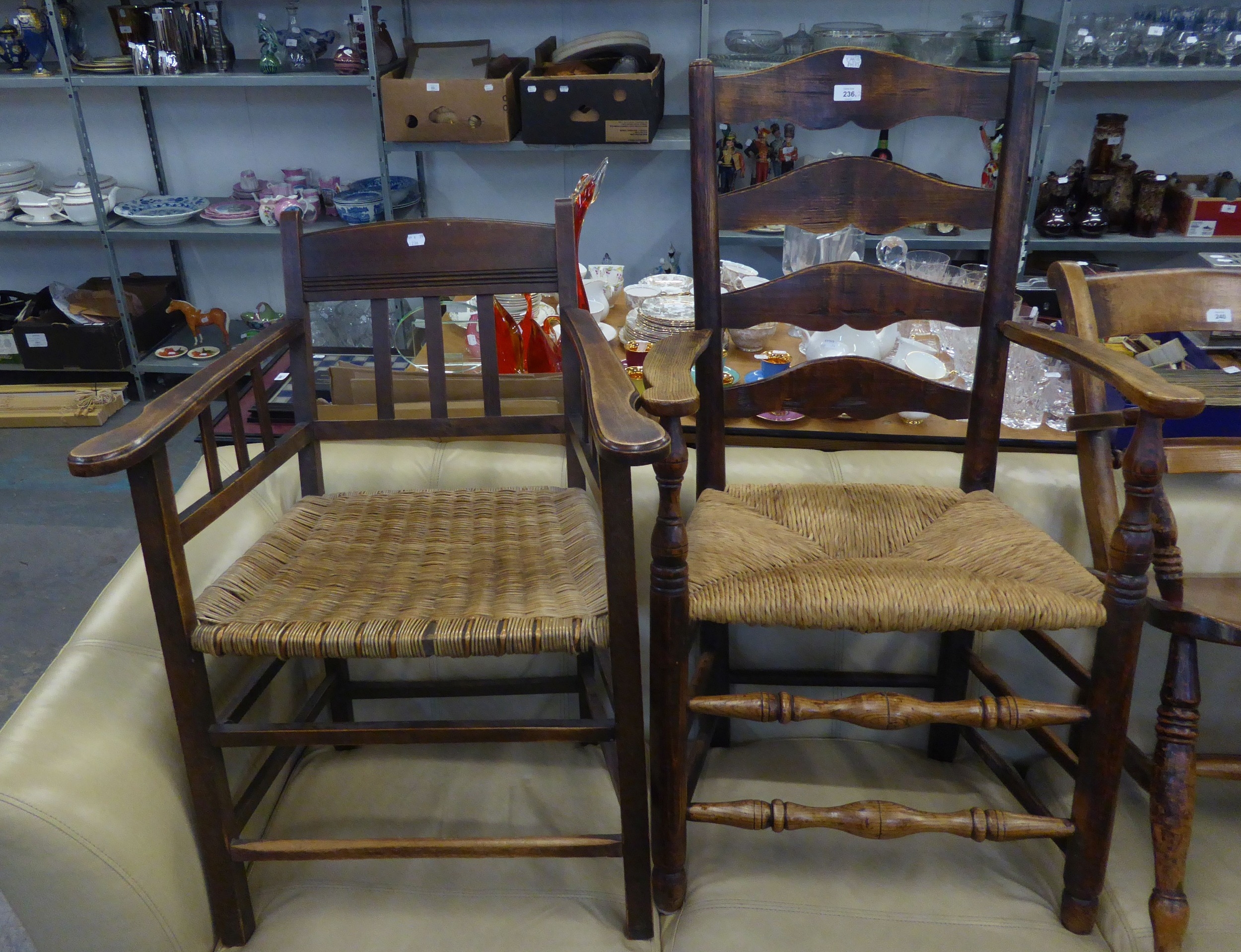 A LARGE SHAKER STYLE RUSH SEATED OPEN ARMCHAIR/CARVER PLUS AN OAK ARTS AND CRAFTS STYLE RUSH