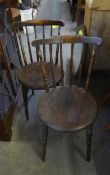 SET OF FOUR HARDWOOD COMB-BACKED CHAIRS WITH CIRCULAR PANEL SEATS