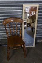 AN OAK SPINDLE-BACK COUNTRY DINING CHAIR, AND AN OBLONG ROBING MIRROR (2)