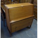 A STYLISH MID-CENTURY TEAK BUREAU, HAVING FALL-FRONT OVER THREE DRAWERS