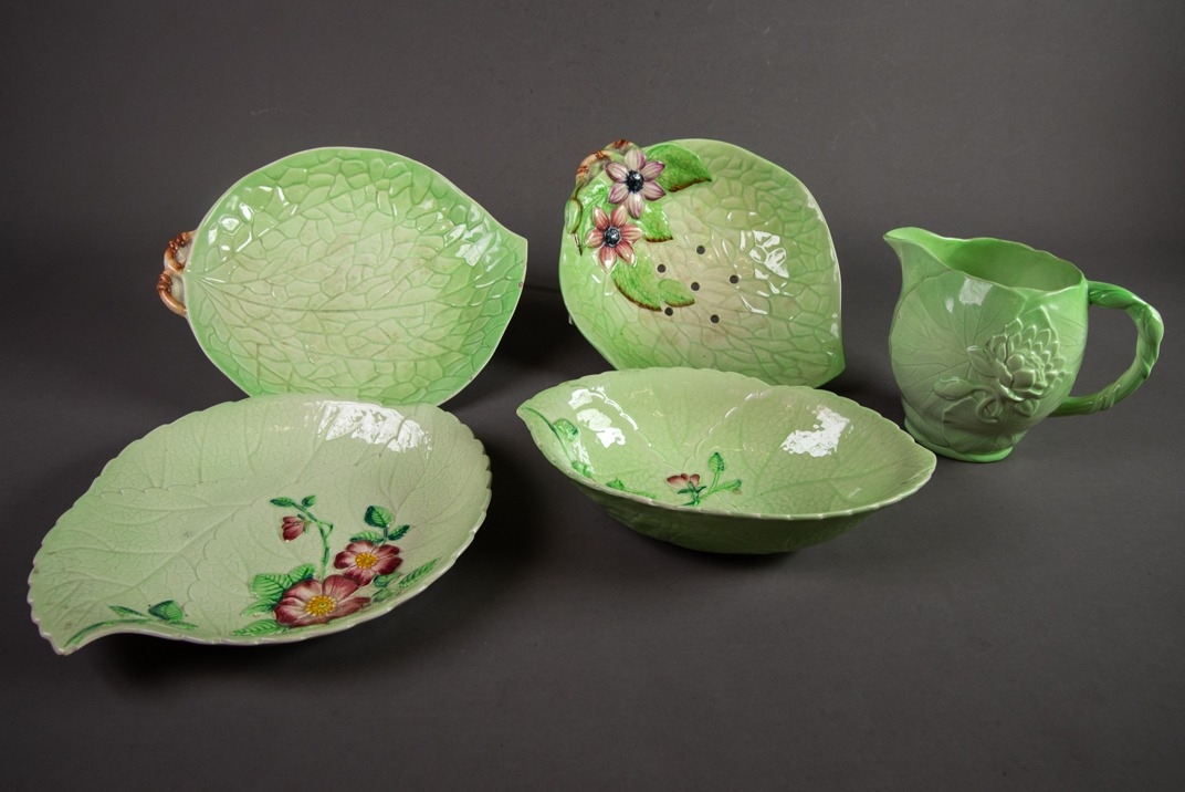 FIVE PIECES OF CARLTON WARE GREEN GLAZED MOULDED POTTERY WITH FLORAL DECORATION, comprising: