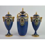 THREE EARLY TWENTIETH CENTURY ROYAL WORCESTER POWDER BLUE PORCELAIN VASES AND COVERS, comprising:
