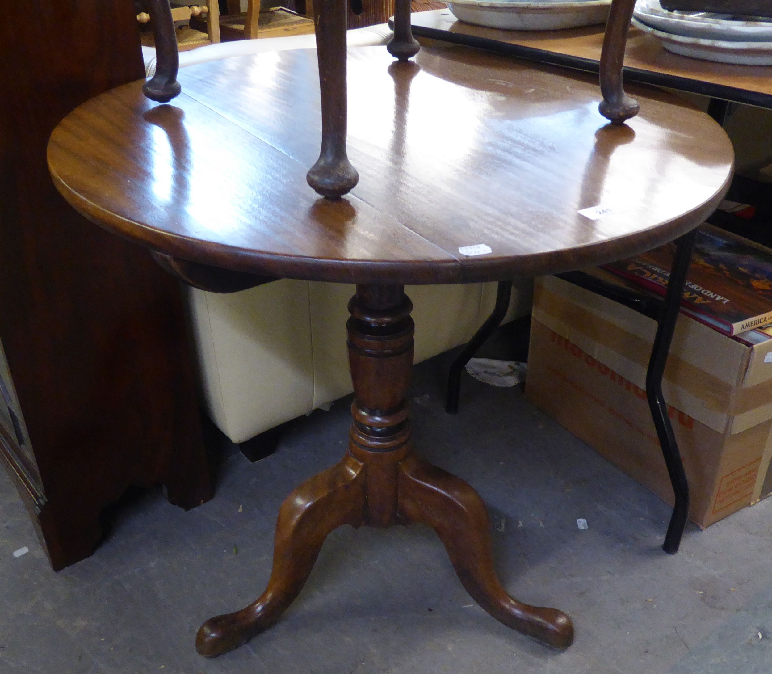 A NINETEENTH CENTURY CIRCULAR SNAP-TOP BREAKFAST TABLE