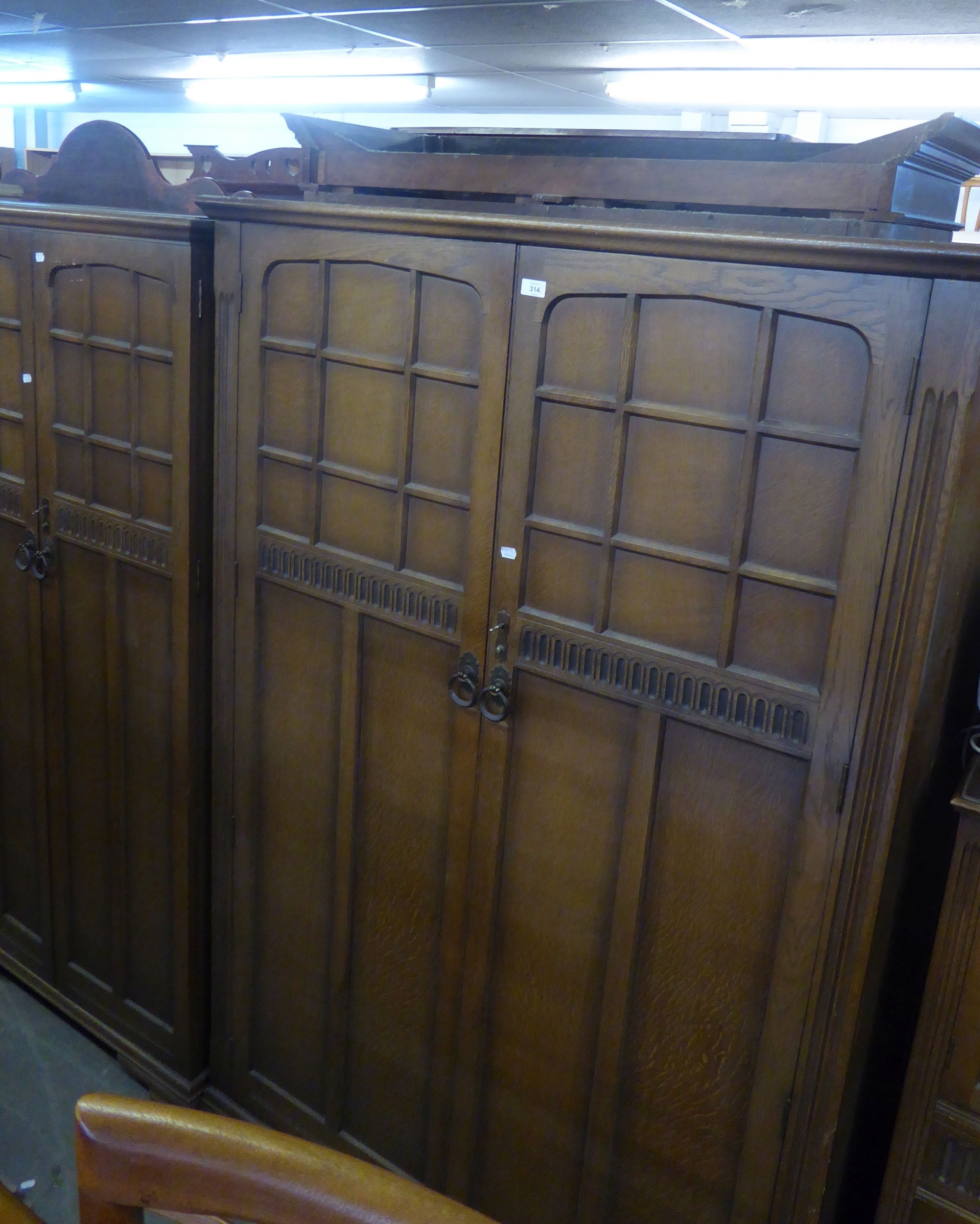 PANELLED OAK BEDROOM SUITE, COMPRISING LADY’S AND GENTS WARDROBES, PEDESTAL DRESSING TABLE WITH