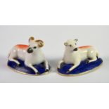 PAIR OF NINETEENTH CENTURY CHARLES BOURNE PORCELAIN MODELS OF RECUMBENT RAM AND EWE, each with burnt