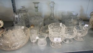 A CUT GLASS SHIPS DECANTER, A SET OF TEN CUT GLASS SUNDAE DISHES, A LARGE CUT GLASS BISCUIT