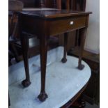 A MAHOGANY HALL TABLE, HAVING LIFT-UP TOP AND RAISED ON LONG LEGS WITH CLAW AND BALL FEET