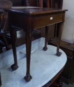 A MAHOGANY HALL TABLE, HAVING LIFT-UP TOP AND RAISED ON LONG LEGS WITH CLAW AND BALL FEET