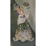CIRCA 1900 CONTINENTAL EARTHENWARE FIGURAL ELECTRIC TABLE LAMP, on scrolliated base, 17 ½" (44.