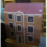 A THREE STOREY DOLLS HOUSE, HAVING TWO FULLY OPENING FRONT DOORS, AND A SELECTION OF DOLLS HOUSE