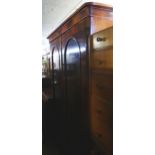 A VICTORIAN MAHOGANY TWO DOOR ARCH-PANEL WARDROBE, WITH GEO. FURNESS CABINET MAKERS LABEL TO THE