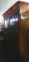 A VICTORIAN MAHOGANY TWO DOOR ARCH-PANEL WARDROBE, WITH GEO. FURNESS CABINET MAKERS LABEL TO THE