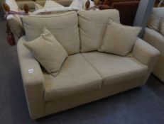 A PAIR OF TWO SEATER SETTEES; A MATCHING ARMCHAIR AND A OTTOMAN SQUARE STOOL, ALL COVERED IN OATMEAL