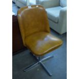 A MID-CENTURY OFFICE CHAIR, COVERED IN BROWN LEATHER ON A CHROME FOUR SPUR BASE