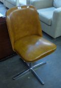 A MID-CENTURY OFFICE CHAIR, COVERED IN BROWN LEATHER ON A CHROME FOUR SPUR BASE