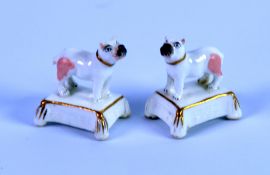 PAIR OF NINETEENTH CENTURY STAFFORDSHIRE PORCELAIN MINIATURE MODELS OF PUGS, each modelled