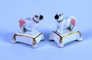 PAIR OF NINETEENTH CENTURY STAFFORDSHIRE PORCELAIN MINIATURE MODELS OF PUGS, each modelled