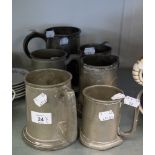 AN ANTIQUE PEWTER QUART TANKARD AND FIVE HAMMERED PEWTER TANKARDS (6)