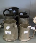 AN ANTIQUE PEWTER QUART TANKARD AND FIVE HAMMERED PEWTER TANKARDS (6)