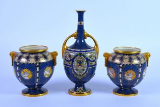 THREE EARLY TWENTIETH CENTURY ROYAL WORCESTER POWDER BLUE PORCELAIN VASES, comprising: ORBICULAR,