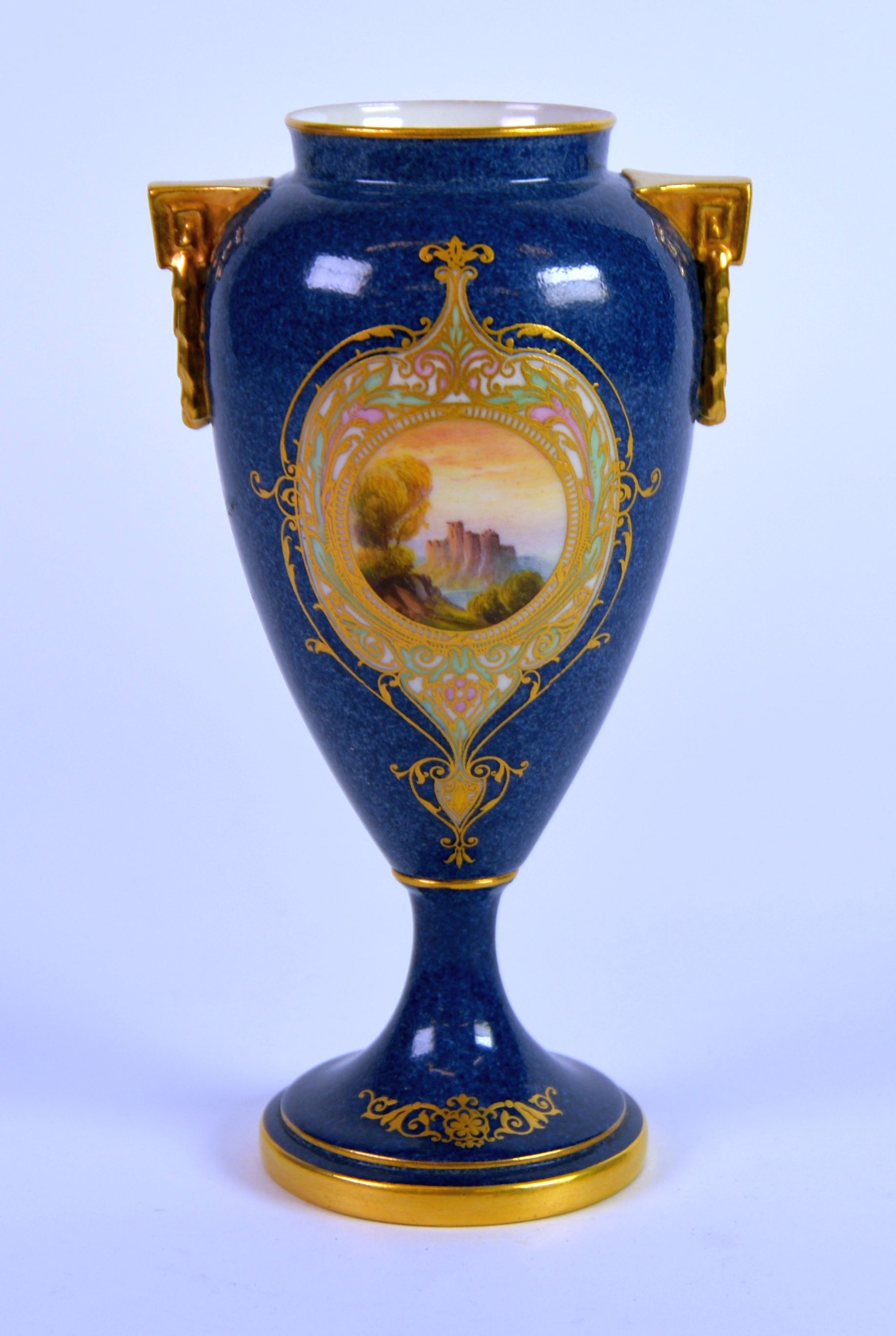 EARLY TWENTIETH CENTURY ROYAL WORCESTER HAND PAINTED POWDER BLUE PORCELAIN TWO HANDlED PEDESTAL