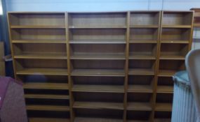 A RANGE OF FIVE 7' 2 1/2" OAK 6 SHELF OPEN BOOKCASES, COMPRISING OF TWO 3'4" BOOKCASES AND THREE 1'