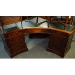 LARGE MAHOGANY LEATHER-INLAID CORNER DESK, HAVING GREEN LEATHER INSET TOP, TWO PEDESTALS ONE WITH