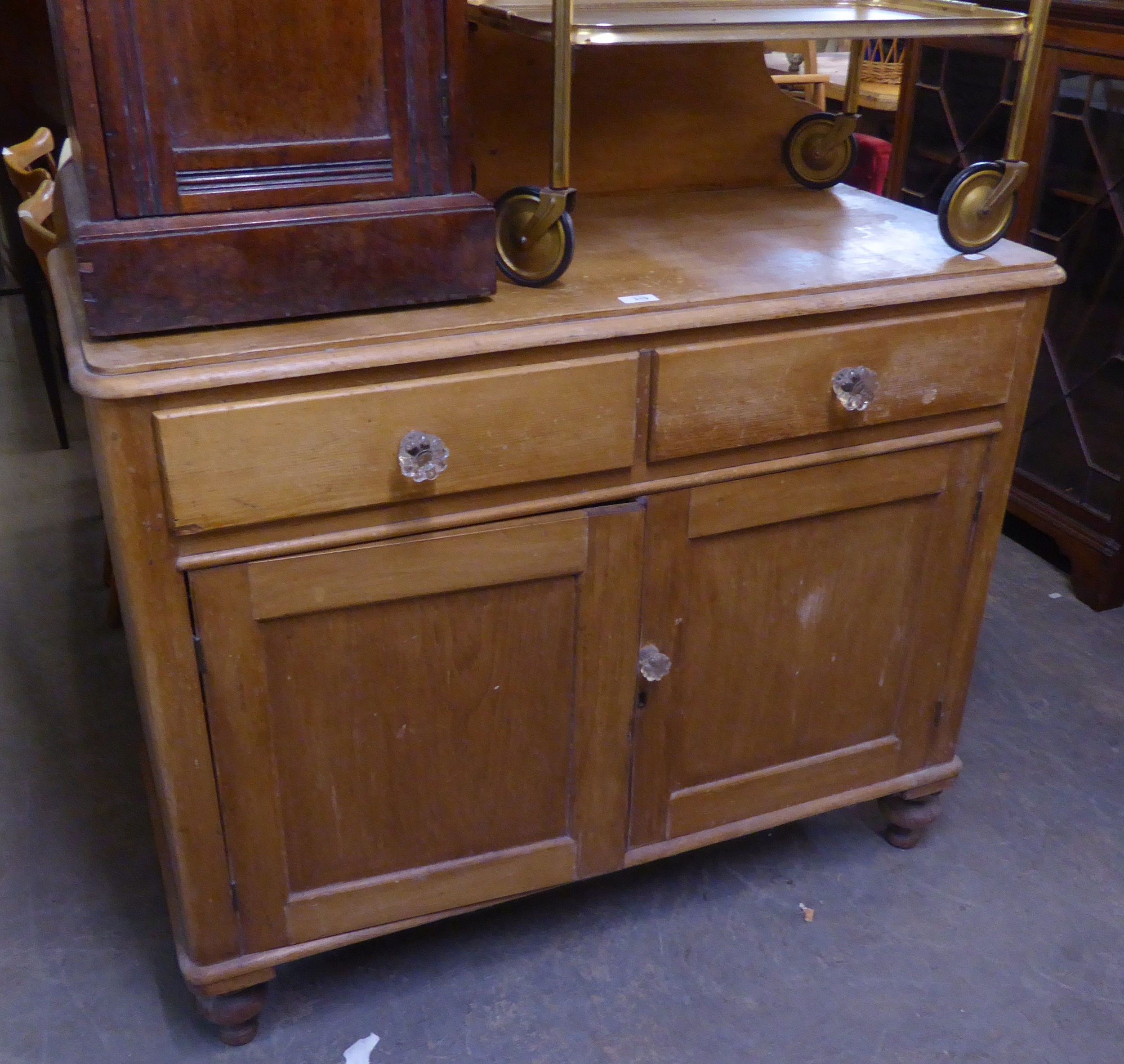VICTORIAN PINE WASHSTAND WITH RAISED BACK, TWO DRAWERS OVER A CUPBOARD WITH TWO DOORS
