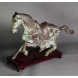 ORIENTAL ANTIQUE STYLE PATINATED BRONZE MODEL OF A CEREMONIAL HORSE, modelled in trotting pose,